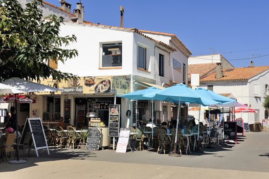 coffee shop in the city center of Saintes-Maries-de-la-Mer in the summer.