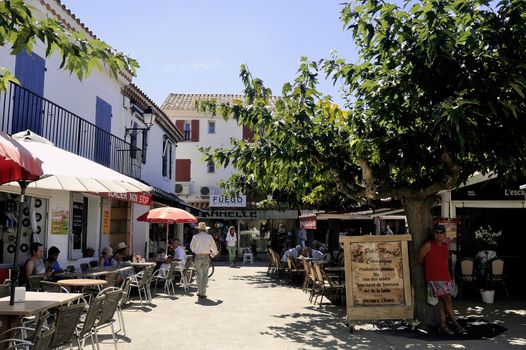restaurants in the city center of Saintes-Maries-de-la-Mer in the summer.