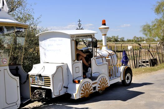 The locomotive of the little train ride Saintes-Maries-de-la-Mer that makes visiting the city and its environs Camargue tourists.