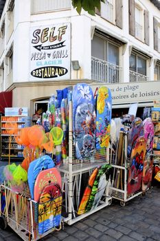 beachwear shop in the town of Saintes-Maries-de-la-Mer center during the summer season.