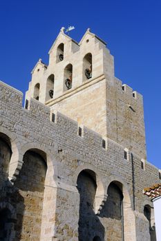 Steeple of the church of Saintes-Maries-de-la-Mer where the crypt contains the satue of Saint Sara patron saint of the Gypsies.