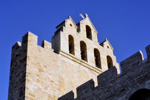 Steeple of the church of Saintes-Maries-de-la-Mer where the crypt contains the satue of Saint Sara patron saint of the Gypsies.