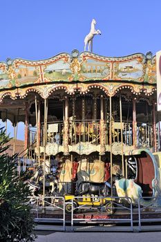 carousel with wooden horses decoration typical Camargue Saintes-Maries-de-la-Mer.