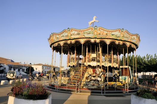 carousel with wooden horses decoration typical Camargue Saintes-Maries-de-la-Mer.