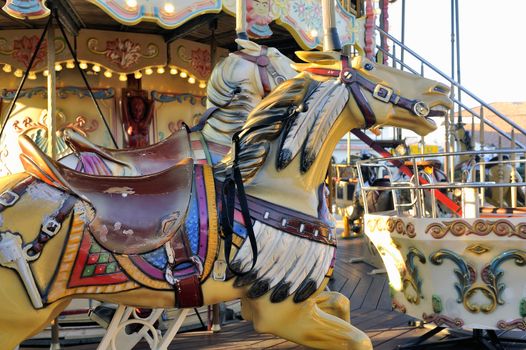 carousel with wooden horses decoration typical Camargue Saintes-Maries-de-la-Mer.