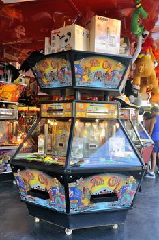 Games funfair on the seafront in Saintes-Maries-de-la-Mer in the Camargue during the summer season.