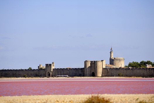 The ramparts of the walled city of Aigues-Mortes seen pink salt