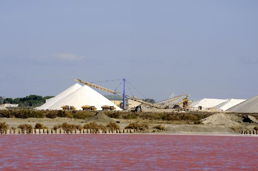 Site operating sea salt saline Aigues-Mortes in the season when a pink algae grow in the water, which gives this beautiful color.