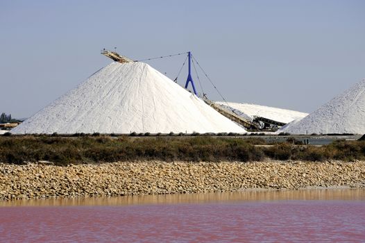 Site operating sea salt saline Aigues-Mortes in the season when a pink algae grow in the water, which gives this beautiful color.