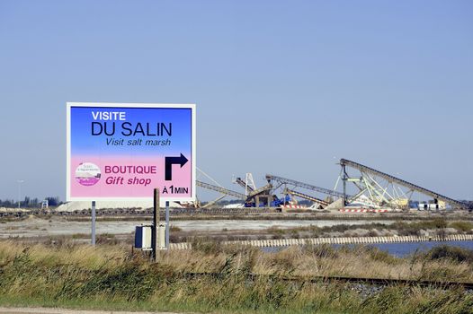 billboard saline Aigues-Mortes in Camargue to announce that tourists can visit the industrial enterprise.