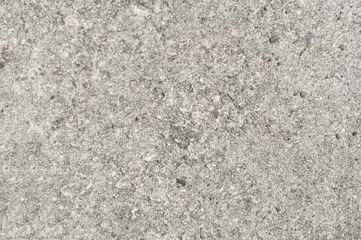 Cement wall background with rough surface texture.