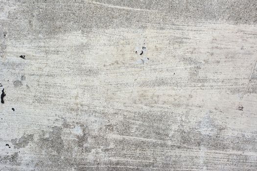 Cement wall background with rough surface texture.