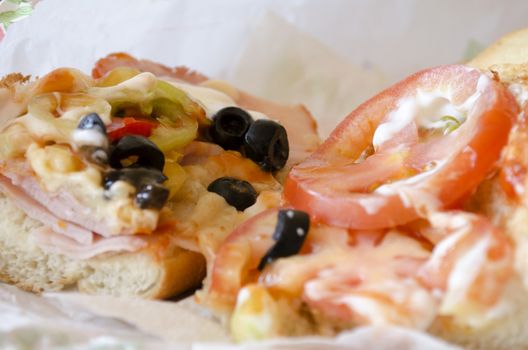 Bulgaria sandwich with tomatoes,olives,cheese,meet and mayonnaise fresh baguette