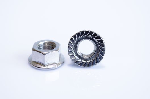 A flange nut is a nut that has a wide flange at one end that acts as an integrated, non-spinning washer.