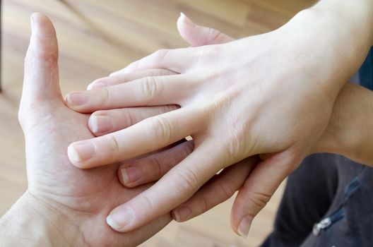 Friendly handshake. Man and woman shaking hands as welcoming gesture.