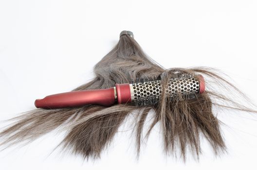 Red Plastic Hairbrush on white background