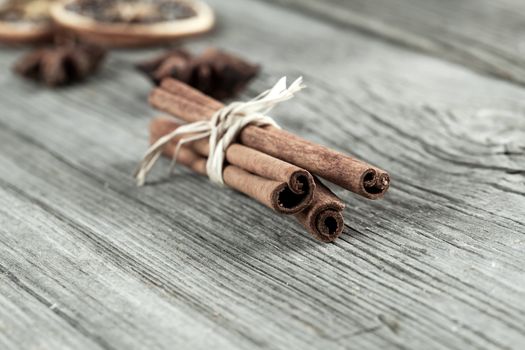 Cinnamon sticks, close up on wooden table