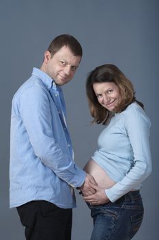 expecting couple - man touching his pregnant wife�s belly