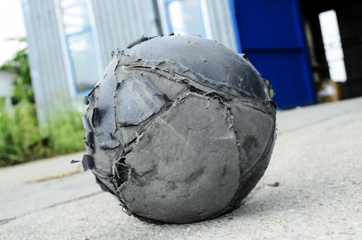 Old football ball badly ragged