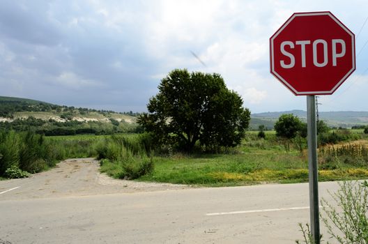 Stop sign in country road