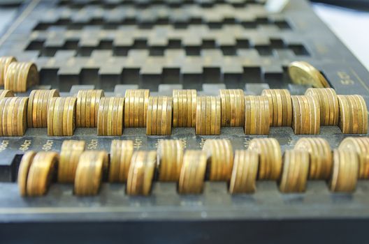 Golden coins on a black dust tray