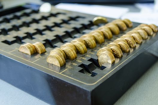 Golden coins on a black dust tray