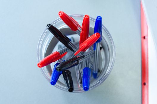 Many multicolor felt pens on wooden desk