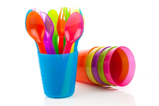 bright plastic tableware, isolated on white background