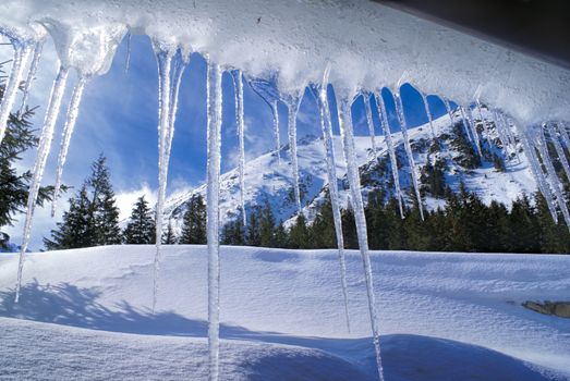 Breathtaking view of Slovak mountains behind huge icicles