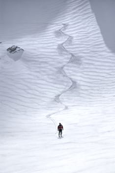 Astonishing view of a skier at the foot of a ski slope