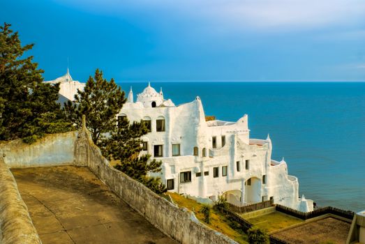 Side-view of Carlos Paez Villaro's villa with azure ocean in the background