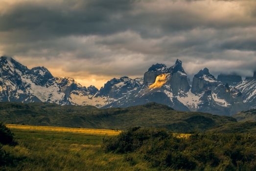 Breathtaking view of sunset over snowy mountains in Torres del Paine National Park