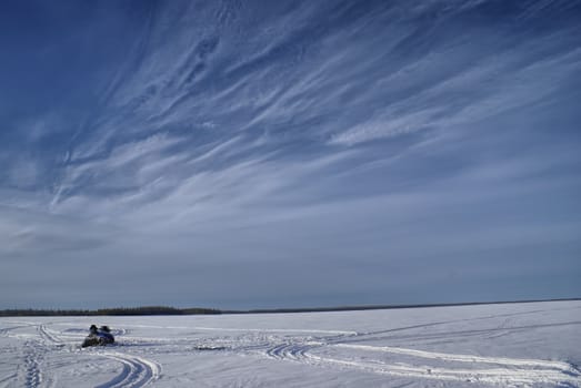 Panoramic view of tracks left in snow on a snowy plain                  
