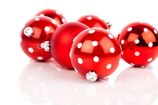 red polka dot Christmas bauble, isolated over white