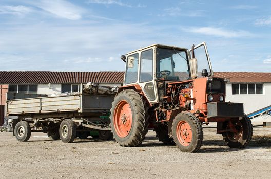 Old farm tractor may be still in use, but very rusty