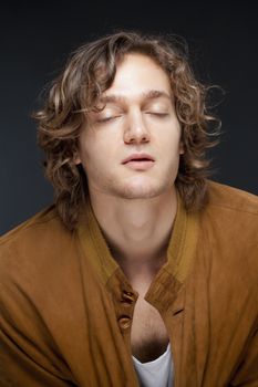 Portrait of a Young Man with Brown Hair and Closed Eyes