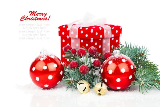Christmas balls and fir branches with decorations isolated over white