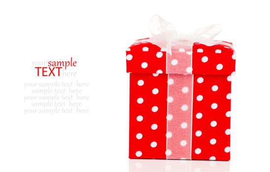 red gift box with bow on white background