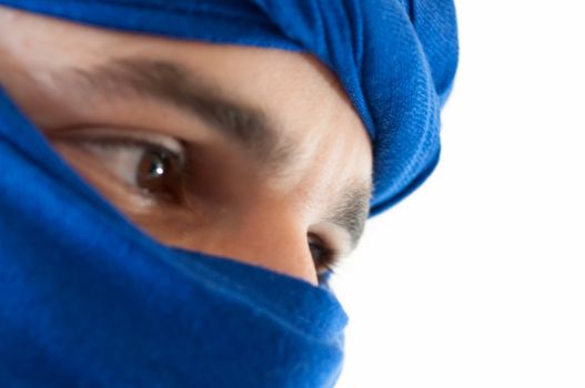 beautiful macro of man with blue keffiyeh