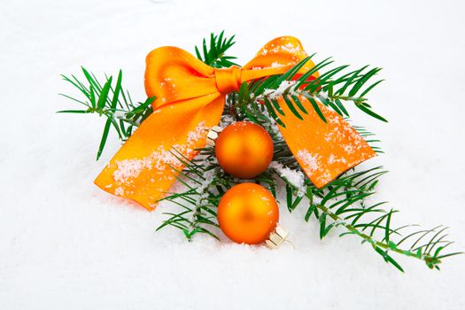 Christmas balls and fir branches with decorations isolated over white