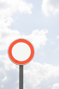 Isolated road sign with sky in background.