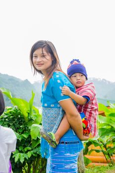 CHIANG MAI -THAILAND OCTOBER 18: Unidentified Pa-Ka-Geh-Yor (Karen Sgaw) and children 2-6 year old in Tribal dress for photograph at Doi Inthanon on October 18, 2014 in Chiang Mai,Thailand. Pa-Ka-Geh-Yor are an ethnic group spread north of Thailand.