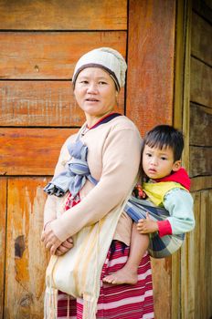 CHIANG MAI -THAILAND OCTOBER 18: Unidentified Pa-Ka-Geh-Yor (Karen Sgaw) and children 2-6 year old in Tribal dress for photograph at Doi Inthanon on October 18, 2014 in Chiang Mai,Thailand. Pa-Ka-Geh-Yor are an ethnic group spread north of Thailand.