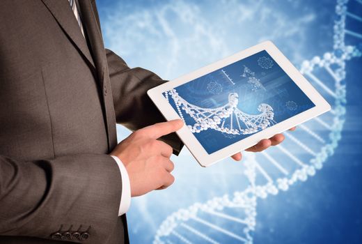 Man hands using tablet pc. Image of DNA helix on tablet screen