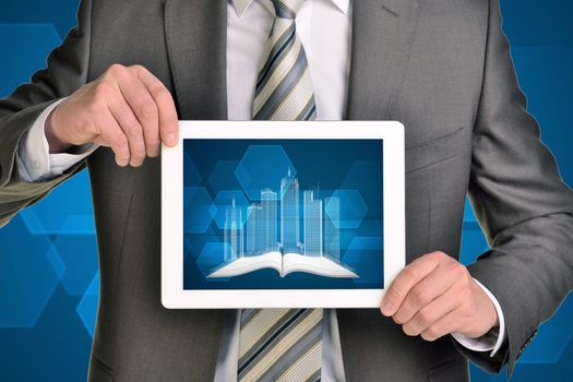 Man hands using tablet pc. Image of wire-frame buildings and open book on tablet screen