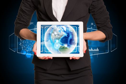 Businesswoman using tablet pc. Image of Earth on tablet screen. Element of this image furnished by NASA