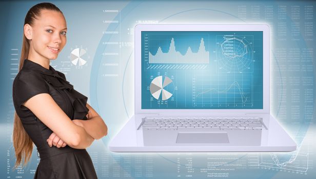 Businesswoman smiling and standing with crossed arms. Open laptop with graphs and graphs with text rows as backdrop