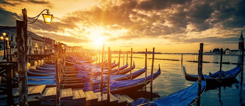 Panoramic view of Venice with gondolas at sunrise, Italy
