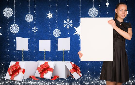 Businesswoman holding empty paper. Christmas gifts as backdrop