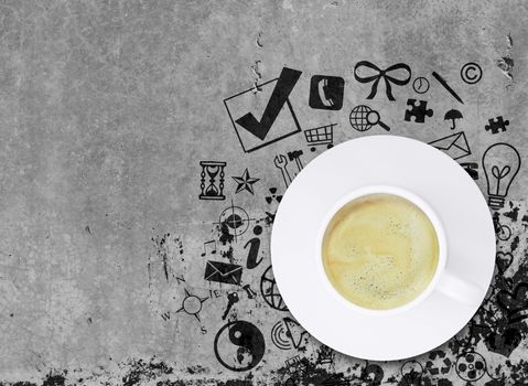 Coffee cup on concrete floor with various social icons. Business concept
